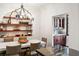 Charming dining room with custom shelving and adjacent beverage center for entertaining guests at 1598 W Sussex Rd, Atlanta, GA 30306