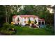 Exterior elevation of a stucco home with red tile roof and manicured front lawn at 1598 W Sussex Rd, Atlanta, GA 30306