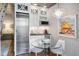 Kitchenette with stainless steel refrigerator, microwave, and table with seating at 1598 W Sussex Rd, Atlanta, GA 30306