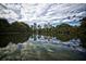 Scenic pond view, reflecting the city skyline, framed by lush trees and sky at 1598 W Sussex Rd, Atlanta, GA 30306