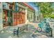 Colorful storefronts showcasing local businesses with a bike-share station for convenient access at 1598 W Sussex Rd, Atlanta, GA 30306