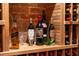 Close-up of wine bottles displayed on wooden racks at 1598 W Sussex Rd, Atlanta, GA 30306