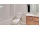 Bathroom with a shower/tub combo and wood vanity at 53 Providence Oak Ct, Lawrenceville, GA 30046