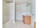 Bathroom with a bathtub and wood cabinets at 53 Providence Oak Ct, Lawrenceville, GA 30046