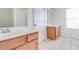 Bathroom boasts double sinks and wood cabinets at 53 Providence Oak Ct, Lawrenceville, GA 30046