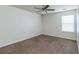 Simple bedroom with ceiling fan and window at 53 Providence Oak Ct, Lawrenceville, GA 30046