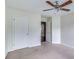 Spacious bedroom with ceiling fan and ample closet space at 53 Providence Oak Ct, Lawrenceville, GA 30046