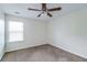 Bright bedroom with ceiling fan and neutral carpeting at 53 Providence Oak Ct, Lawrenceville, GA 30046