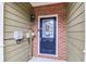 Front door entrance with brick and siding accents at 53 Providence Oak Ct, Lawrenceville, GA 30046