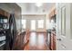 Modern kitchen with black appliances and hardwood floors at 53 Providence Oak Ct, Lawrenceville, GA 30046