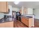 Modern kitchen with dark countertops and wood cabinets at 53 Providence Oak Ct, Lawrenceville, GA 30046