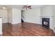 Large living room with hardwood floors, fireplace, and stairs at 53 Providence Oak Ct, Lawrenceville, GA 30046