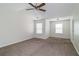 Spacious main bedroom with carpeted floors and ceiling fan at 53 Providence Oak Ct, Lawrenceville, GA 30046