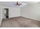 Large main bedroom with carpeted floor and ceiling fan at 53 Providence Oak Ct, Lawrenceville, GA 30046