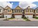 Charming townhomes with a mix of brick and siding exteriors and attached one-car garages at 53 Providence Oak Ct, Lawrenceville, GA 30046