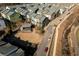 An aerial view of townhouse-style homes with a community firepit and outdoor pavilion at 711 Needletail Way, Atlanta, GA 30312