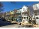 Row of colorful townhouses on tree-lined street at 711 Needletail Way, Atlanta, GA 30312