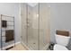 Bathroom with glass shower and neutral tile at 711 Needletail Way, Atlanta, GA 30312