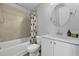 Small bathroom with white vanity and shower/tub combo at 711 Needletail Way, Atlanta, GA 30312