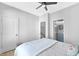 Bedroom featuring ensuite bathroom and large window at 711 Needletail Way, Atlanta, GA 30312