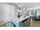 Stylish kitchen island with seating, stainless steel dishwasher, and modern pendant lighting at 711 Needletail Way, Atlanta, GA 30312