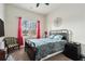 Cozy bedroom with a metal bed frame and red curtains at 105 Couch Ct, Fayetteville, GA 30214