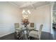 Bright dining room features hardwood floors and a glass-top table at 105 Couch Ct, Fayetteville, GA 30214