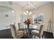 Formal dining room with hardwood floors and a chandelier at 105 Couch Ct, Fayetteville, GA 30214