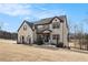 Two-story brick home with a large backyard and mature trees at 105 Couch Ct, Fayetteville, GA 30214