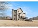 Tan two-story house with deck and hill side yard at 105 Couch Ct, Fayetteville, GA 30214