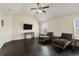 Relaxing sitting area with dark hardwood floors and two chaise lounges at 105 Couch Ct, Fayetteville, GA 30214