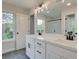 Modern bathroom with double vanity, quartz countertop, and black matte fixtures at 163 Bluffington Way, Marietta, GA 30066