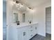 Double vanity bathroom with white cabinets and gray tile floor at 163 Bluffington Way, Marietta, GA 30066