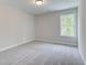 Bright bedroom featuring neutral walls and carpet at 163 Bluffington Way, Marietta, GA 30066