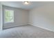 Spacious bedroom with carpet and large window at 163 Bluffington Way, Marietta, GA 30066