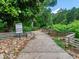 Walking path in a wooded area with split rail fence at 163 Bluffington Way, Marietta, GA 30066