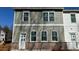 Side view of townhome with brick foundation and modern siding at 163 Bluffington Way, Marietta, GA 30066