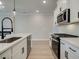 White shaker cabinets, stainless steel appliances and quartz countertops at 163 Bluffington Way, Marietta, GA 30066