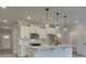 Modern kitchen with white cabinets, quartz countertops, and a large island at 163 Bluffington Way, Marietta, GA 30066