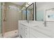 Modern bathroom with double vanity and patterned tile shower at 2335 Mason Dr # D27, Atlanta, GA 30316