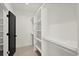 Bright walk-in closet with built-in shelves at 2335 Mason Dr # D27, Atlanta, GA 30316