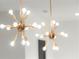 Two modern gold Sputnik style light fixtures in the kitchen at 2335 Mason Dr # D27, Atlanta, GA 30316