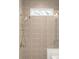 Shower with geometric patterned tile at 2335 Mason Dr # D27, Atlanta, GA 30316