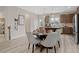 Open concept dining area with kitchen and hardwood floors at 6239 Kenbrook Dr, Tucker, GA 30084