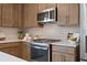 Kitchen detail showing stove and backsplash at 6239 Kenbrook Dr, Tucker, GA 30084