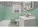 Bathroom with mint green tile and updated vanity at 1189 Rock Cut Rd, Forest Park, GA 30297