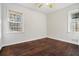 Spacious bedroom featuring hardwood floors and dual windows at 1189 Rock Cut Rd, Forest Park, GA 30297