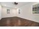 Versatile bonus room with dark wood flooring and new windows at 1189 Rock Cut Rd, Forest Park, GA 30297