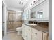 Bathroom boasts tiled shower with glass doors and a granite vanity at 2690 Old Hickory Nw Dr, Marietta, GA 30064