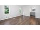 Bright bedroom with hardwood floors, and two windows allowing ample natural light at 2690 Old Hickory Nw Dr, Marietta, GA 30064